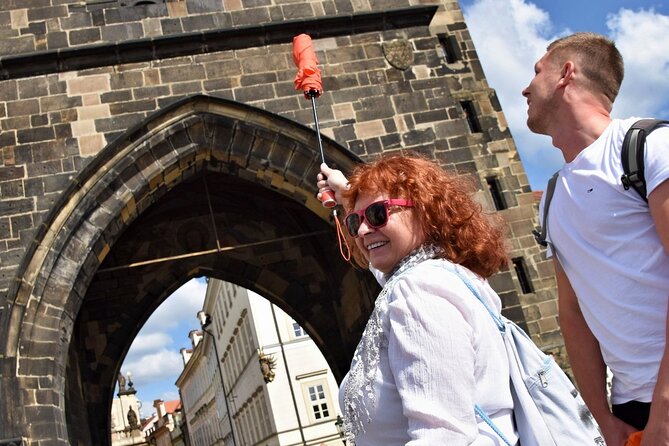 Best of Prague: Private City Walking Tour, Boat Cruise, and Typical Czech Lunch - Crossing Charles Bridge before the crowds build