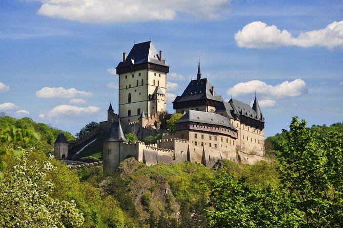 From Prague: Karlstejn with Admission and Pick up - The uphill approach to Karlštejn Castle