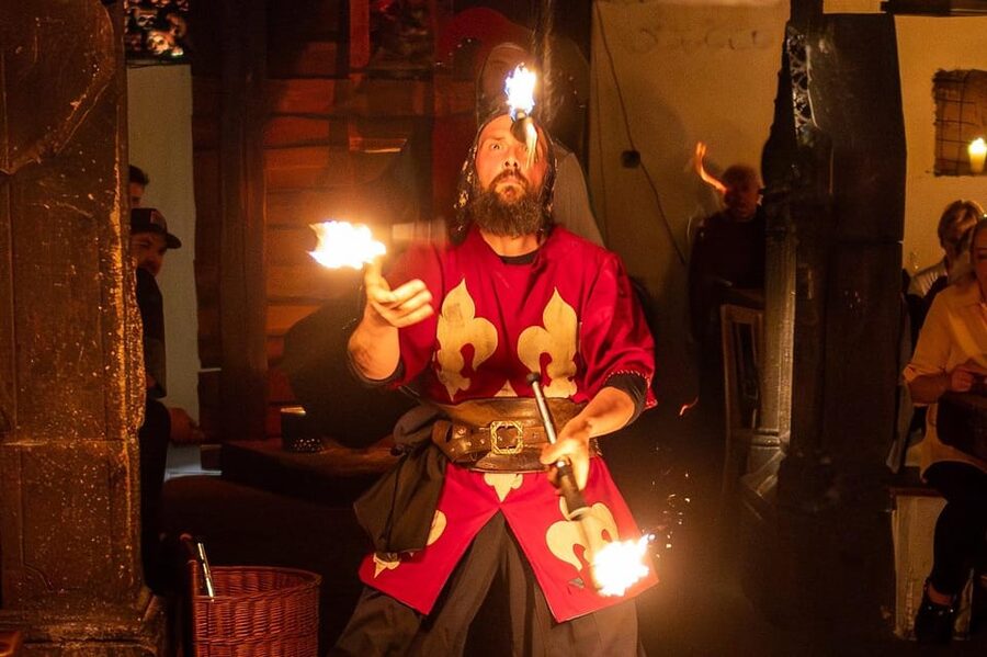 From Prague: Medieval Dinner, Show, Castle and Brewery - Language, group size, and what the evening feels like
