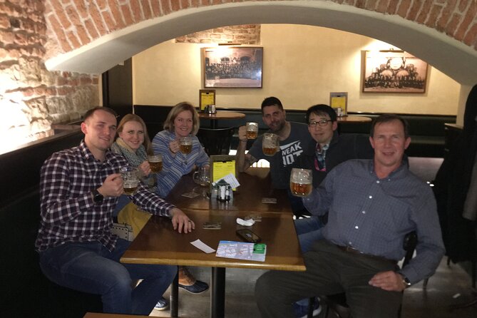 Old Prague pubs tour. Beer and dinner included! - Crossing Charles Bridge between drinks