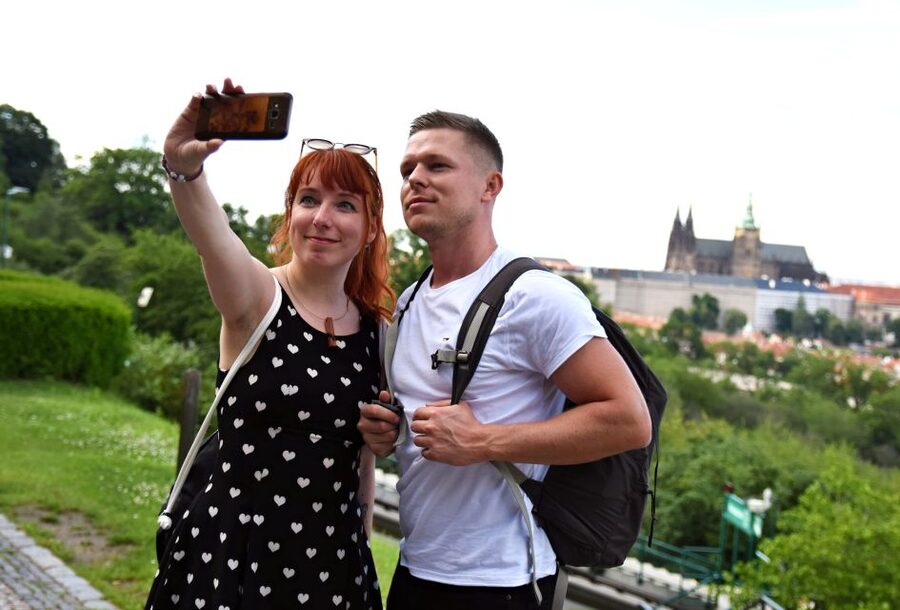 Panoramic Views of Prague Evening Walking Tour - Crossing Charles Bridge toward Prague Castle