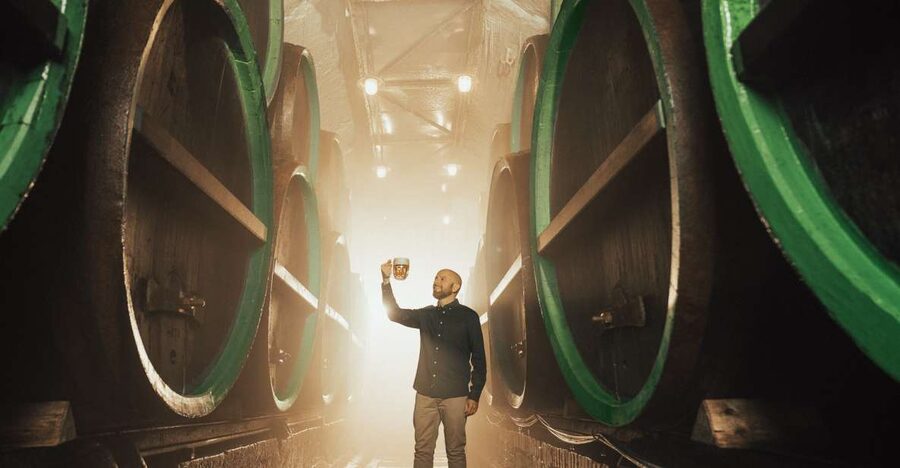 Pilsen: Pilsner Urquell Brewery Tour with Beer Tasting - Riding through a working brewery