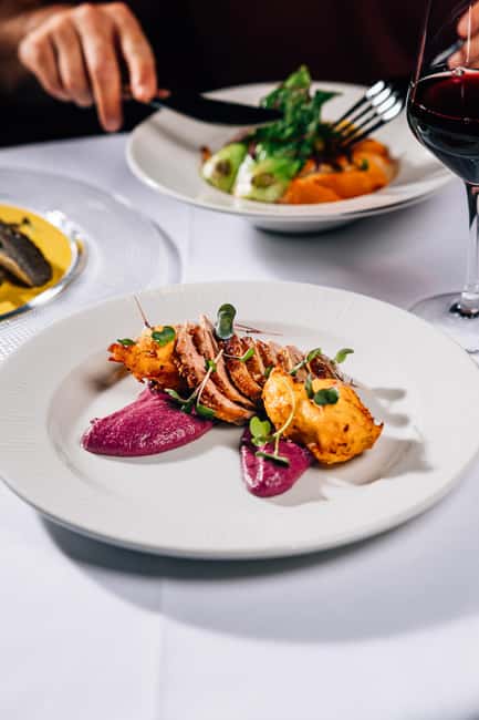 Prague:Breathtaking Cabaret Show with 4-Course Dinner Option - Cancellation, language, and booking flexibility