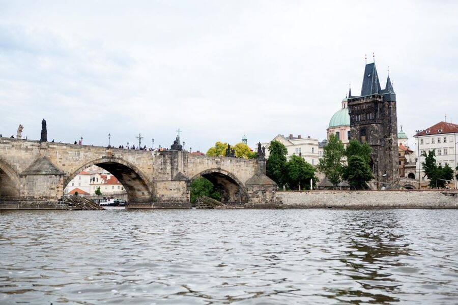 Prague City Tour with Vltava River Cruise - Walking across Charles Bridge and toward the castle