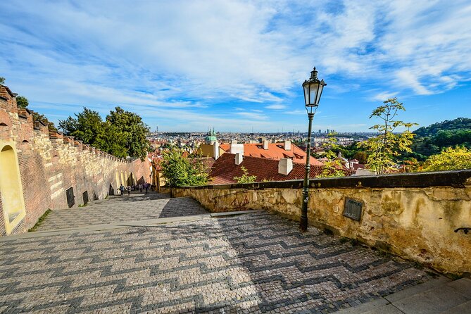 Prague DeLuxe Tour: Views, Hidden Gems, Tastings & River Cruise - Riding Tram 22 toward Prague Castle