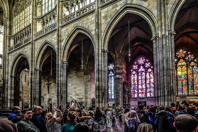 Prague DeLuxe Tour: Views, Hidden Gems, Tastings & River Cruise - Crossing into Lesser Town through the Infant Jesus of Prague