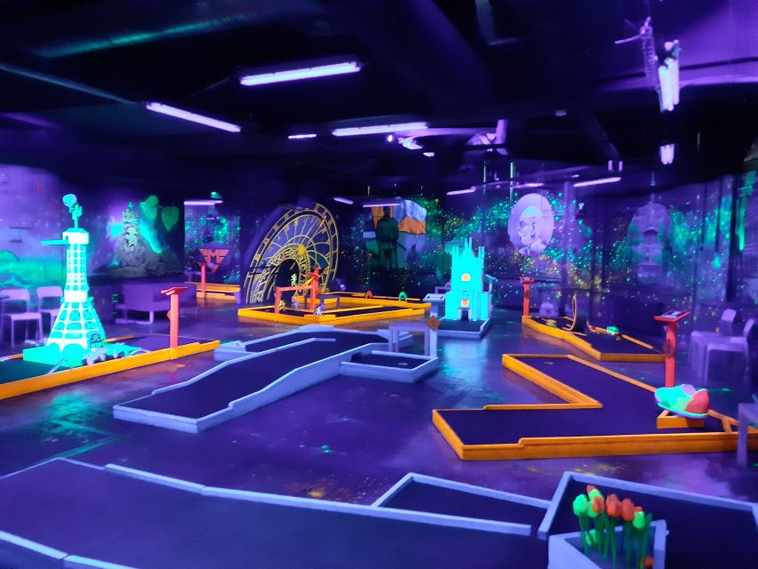 Prague: Glow Golf Mini Golf Game by UV Light - Glow paint, sticks, and photo-friendly details