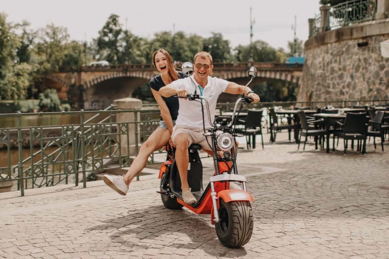 Prague: Guided Fat Tire e-Scooter Tour - Crossing Prague’s old and new city