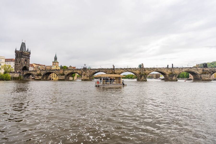 Prague: Party Tiki Boat Sightseeing Cruise with Drinks - From the National Theatre toward Charles Bridge