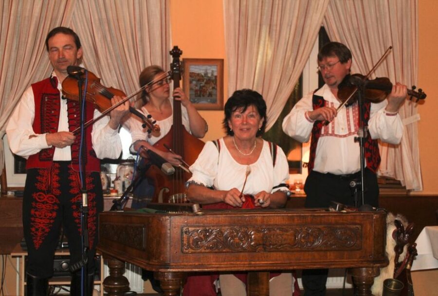 Prague: Traditional Folklore Evening with Dinner & Music - Entering the Prague wine cellar