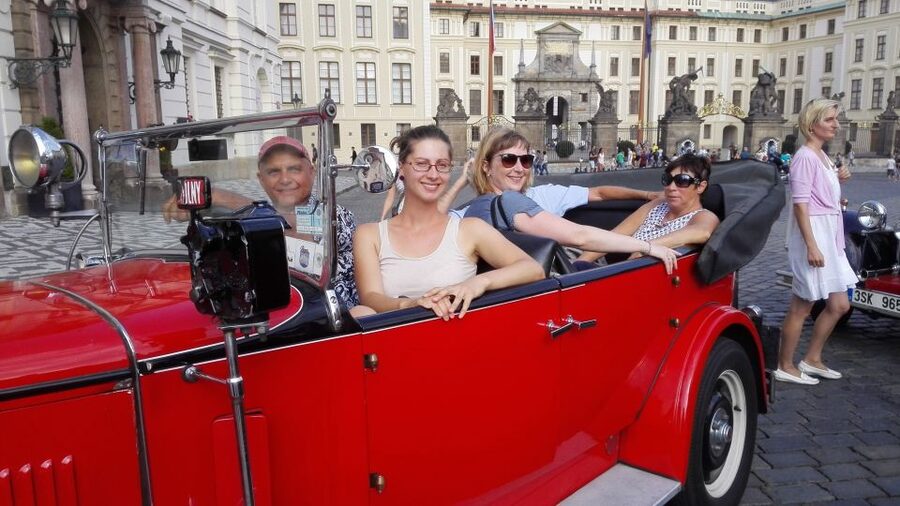 Prague: Vintage Car Ride and Walking Tour - Walking down toward Charles Bridge