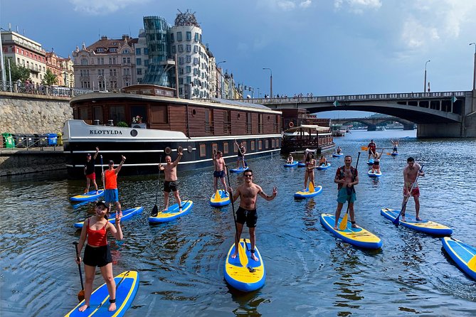 Stand-Up Paddleboarding on the Vltava River in Prague - Learning to stand up before the city tour begins